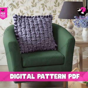 May include: A woven, lavender-colored pillow rests on a green armchair. The pillow has a textured, chunky knit design with a darker purple border. The words "DIGITAL PATTERN PDF" are displayed in pink text at the bottom of the image.