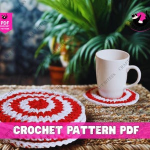 May include: A white ceramic mug sits on a red and white crocheted coaster. Another coaster is nearby. The coasters feature a spiral pattern. The image includes the text "CROCHET PATTERN PDF".