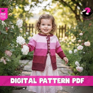 May include: A young child wearing a pink and burgundy striped cardigan with button closures, holding white flowers. The image includes the text "DIGITAL PATTERN PDF" and the Craft Bitess logo.