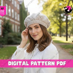 May include: A woman wearing a beige crochet beret. The beret has a textured design and is paired with a white blouse. The image includes text that reads "DIGITAL PATTERN PDF". The background is a blurred outdoor scene.