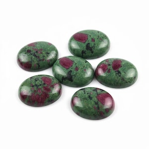 May include: Six oval-shaped gemstones with a polished finish. The stones feature a mottled green base color with irregular patches of deep red and black. The gemstones are arranged on a white background.