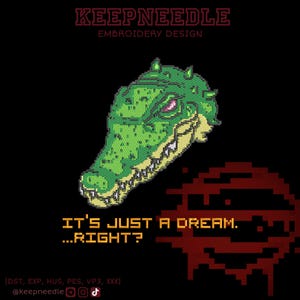 May include: An embroidery design showing a pixelated green alligator head with sharp teeth and red eyes. The text "IT'S JUST A DREAM...RIGHT?" is below the alligator. The design is set against a black background with the text "KEEPNEEDLE EMBROIDERY DESIGN" at the top.