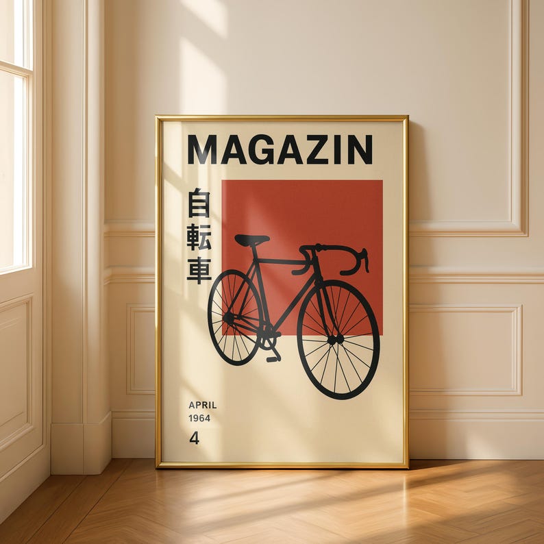 May include: Framed poster with a gold border. The poster features a black bicycle illustration on a cream background with a red square. The word "MAGAZIN" is at the top, with Japanese characters and the text "APRIL 1964 4" at the bottom.