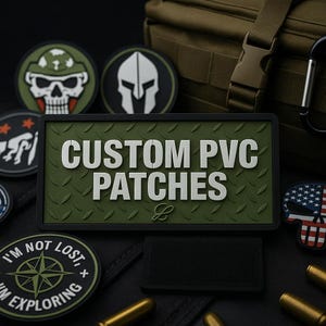 May include: A collection of custom PVC patches in various designs. The central patch reads "CUSTOM PVC PATCHES" in white, raised lettering on a green diamond-plate background. Other patches feature skulls, a Spartan helmet, and a compass.