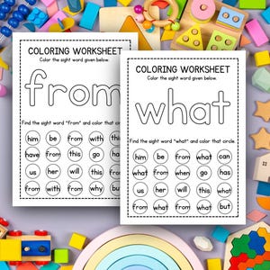 May include: Two white coloring worksheets with the words "from" and "what" printed in large letters. Each worksheet has a section to find and color the sight word. The worksheets are surrounded by colorful wooden toys.