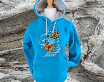 Sudadera con capucha y bordado de mariposas Merry Monarch; sudadera turquesa con capucha para adultos.