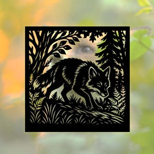 May include: A black silhouette of a fox walking through a forest scene. The artwork is cut from a square shape, with trees, leaves, and grass details. The background is blurred with shades of green and yellow.