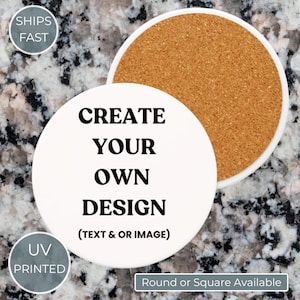 May include: White ceramic coaster with the text "CREATE YOUR OWN DESIGN" in black. The coaster has a cork backing and the text "(TEXT & OR IMAGE)" below the main text. The image also includes the text "UV PRINTED" and "Round or Square Available".