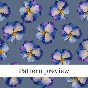 May include: A repeating pattern of watercolor pansy flowers in shades of blue, purple, and yellow on a muted blue background. The text "Pattern preview" is displayed in a white rectangular box at the bottom of the image.