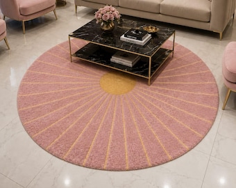 Luxury Modern Pink Round Area Rug with Elegant Golden Sunburst Pattern and Textured Finish