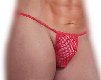 May include: Red crochet thong underwear. The underwear features a net-like design and a thin string waistband. The garment is made of a soft, textured material.