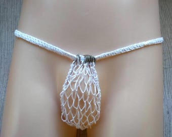 May include: White crochet underwear with a net-like pouch and a thin waistband. The underwear features a series of small metal rings at the front. The garment is displayed on a mannequin.