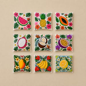May include: A set of nine square throw pillows arranged in a grid, each featuring a unique tropical fruit illustration including watermelon, pineapple, papaya, dragon fruit, coconut, passion fruit, mango, bananas, and a lemon, surrounded by flowers.