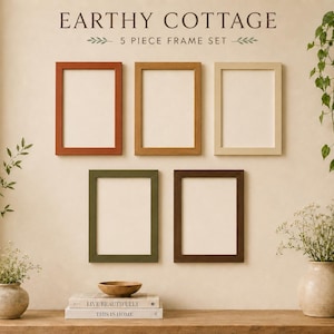 May include: A five-piece rectangular picture frame set in terracotta, mustard, cream, olive green, and dark brown. The text above reads EARTHY COTTAGE 5 PIECE FRAME SET. The frames are arranged in a gallery style on a wall above a wooden surface.
