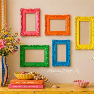 May include: Five colorful, ornate picture frames in pink, orange, green, blue, and yellow are mounted on a beige wall. A vase of flowers, a lamp, and decorative items sit on a yellow table. The text "Printable Palette Joy" is visible.