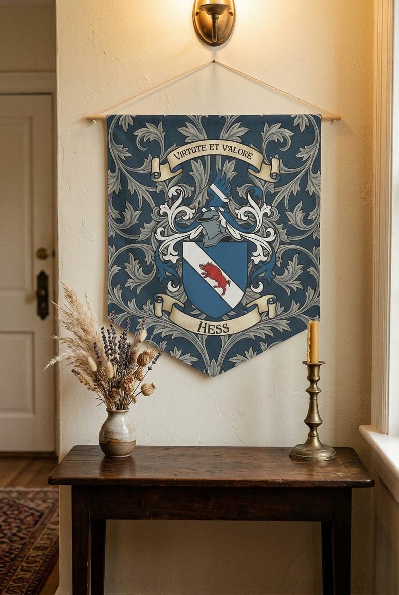 May include: A navy blue banner with a family crest design. The crest features a shield with a red boar, a helmet, and the name "Hess" below. The banner also includes the phrase "Virtute et Valore" and decorative floral patterns.