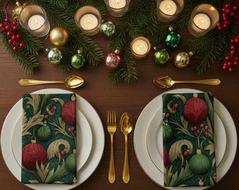 May include: A festive table setting with white plates, gold cutlery, and patterned napkins featuring red and green ornaments. Lit candles, evergreen branches, and red berries complete the holiday decor. Gold spoons and forks are placed on either side of the plates.