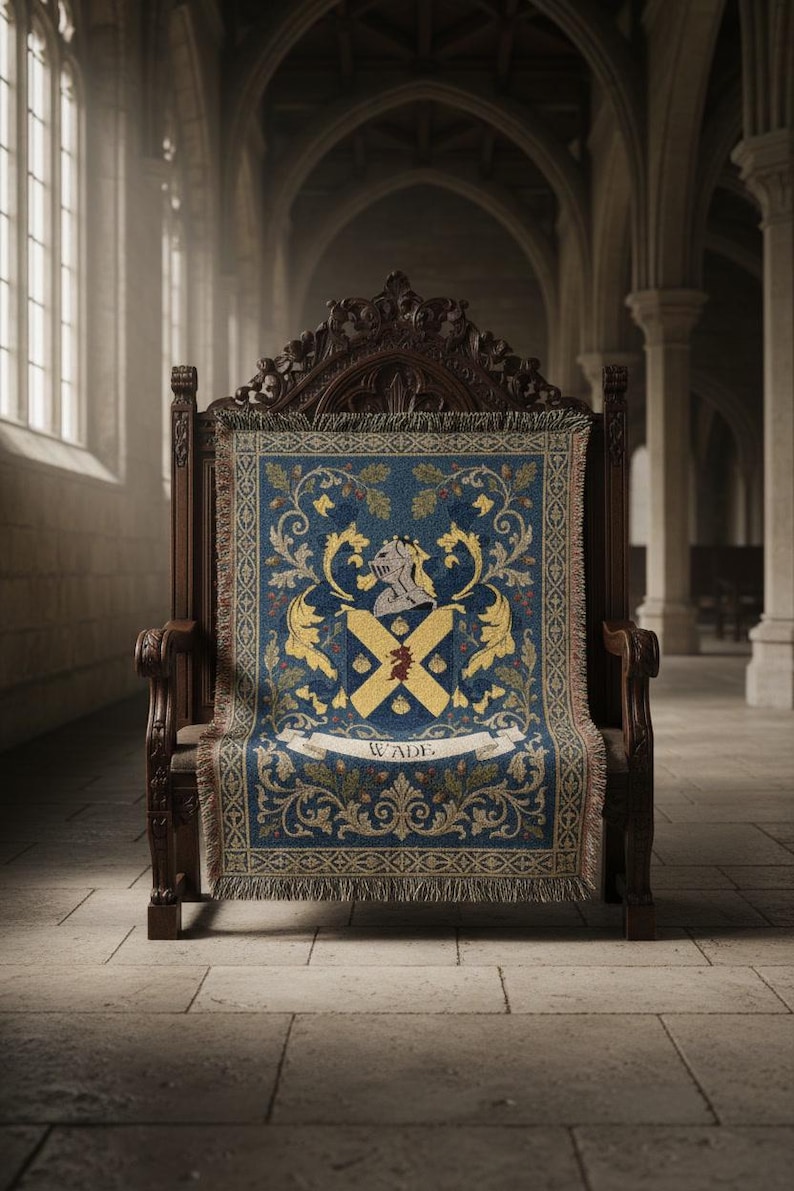 May include: A dark wooden throne with an ornate back and armrests. A blue tapestry with a crest design featuring a helmet, cross, and the name "WADE" is draped over the seat. The tapestry has gold and cream-colored accents.