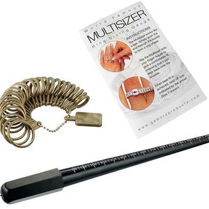 May include: A set of gold-colored metal ring sizers on a chain, a black tapered ring mandrel with white measurement markings, and a white instructional card titled World Famous MULTISIZER Ring Sizing Gauge with printed text and diagrams.