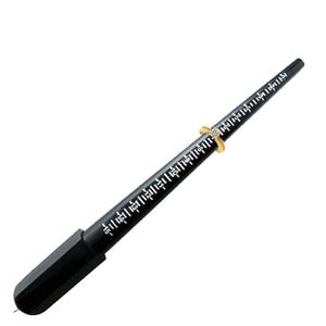 May include: A black ring sizer tool with white measurement markings. A gold ring with a diamond is placed on the sizer. The tool is used to determine ring sizes, and is set against a white background.