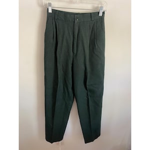 May include: High-waisted trousers in a dark green and black micro-check pattern. These pants feature a structured waistband with belt loops, a single button closure, a front zipper fly, and vertical pleats extending down the front of each leg.