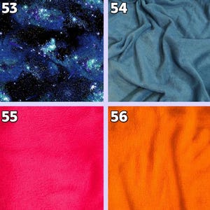 May include: Four fabric swatches. Top left: a dark blue and black starry night pattern. Top right: a light blue, soft, textured fabric. Bottom left: a bright pink fabric. Bottom right: an orange fabric.