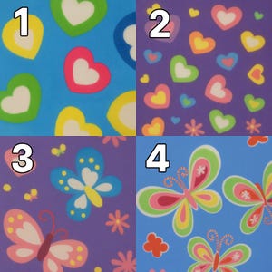 May include: A colorful pattern featuring hearts, butterflies, and flowers in various colors. The design includes a blue background with yellow, green, pink, and white heart shapes. Butterflies and flowers are also present.