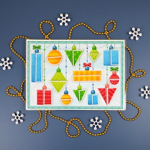 May include: A festive Christmas-themed illustration featuring colorful ornaments and gift boxes in various shapes. The ornaments are in red, blue, green, and orange, with gold string and white snowflake accents. The image is set against a dark blue background.