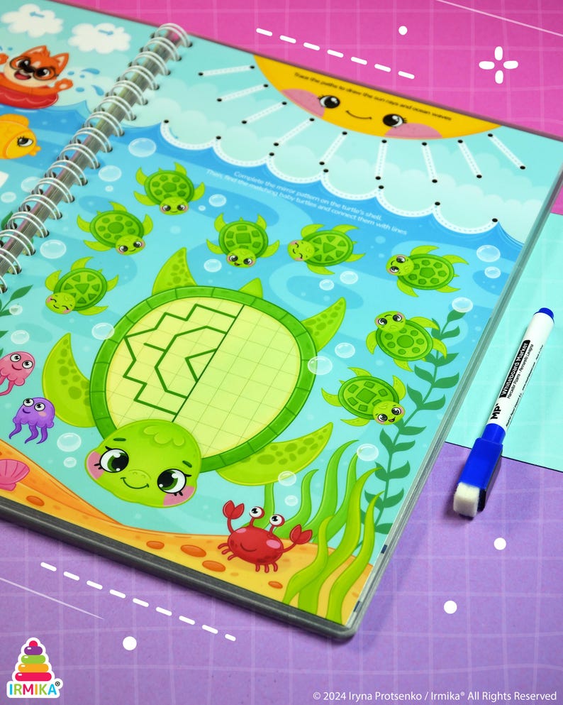 May include: A spiral-bound activity book with a colorful underwater theme. The cover features a large green turtle with a patterned shell, surrounded by smaller turtles, fish, and a crab. A blue and white marker is visible.
