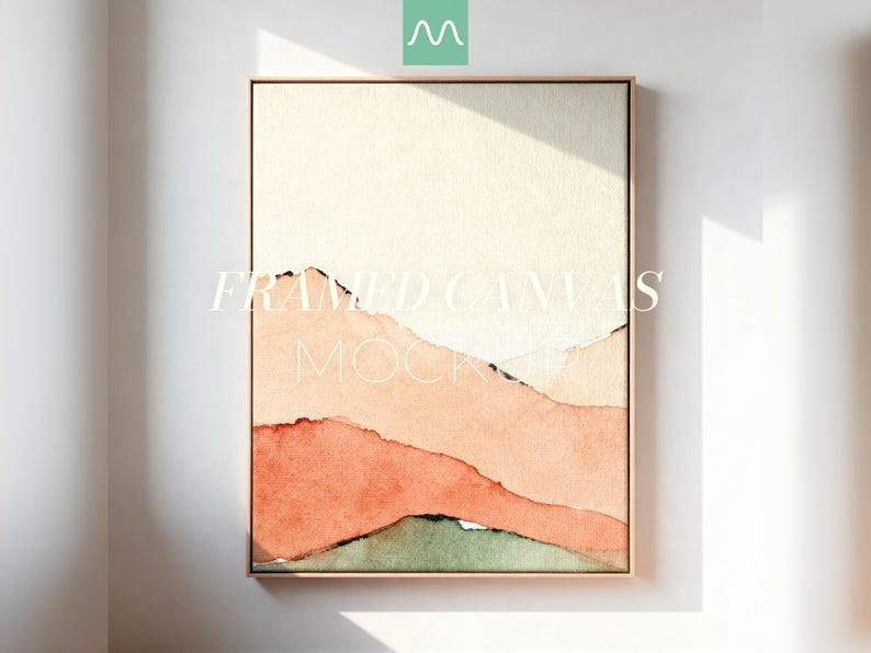 May include: A vertical framed canvas featuring an abstract watercolor landscape with layered hills in shades of cream, peach, terracotta, and muted green. The text FRAMED CANVAS MOCKUP is centered over the artwork in a thin white serif font.