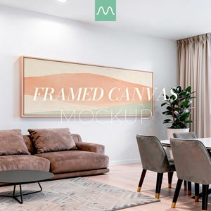 May include: A horizontal framed canvas wall art piece featuring an abstract landscape with soft peach, beige, and sage green color blocks. The artwork is displayed on a white wall above a brown sofa, with the text FRAMED CANVAS MOCKUP overlaid.