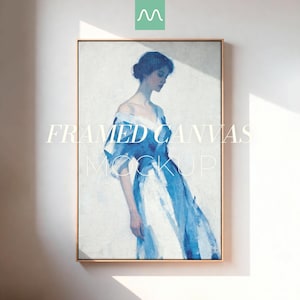 Puede incluir: Un lienzo enmarcado vertical que presenta una pintura impresionista de una figura con un vestido fluido azul y blanco. La obra de arte está encerrada en un marco metálico fino y muestra el texto superpuesto en blanco FRAMED CANVAS MOCKUP.