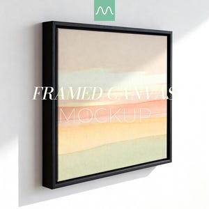 May include: A square canvas print in a black floating frame featuring an abstract landscape with horizontal bands of soft peach, pale yellow, and muted sage green colours. The text "FRAMED CANVAS MOCKUP" is overlaid in white across the centre.
