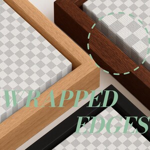 May include: Three rectangular canvas frames featuring wrapped edges, displayed in light wood, dark wood, and black finishes. Each frame contains a white and gray checkered pattern. The text WRAPPED EDGES is overlaid in light green.