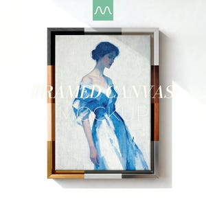 May include: Framed canvas mockup showing a watercolour painting of a woman in a blue dress. The frame has a multi-tone design with wood, black, and silver accents. The text "FRAMED CANVAS MOCKUP" is overlaid on the image.