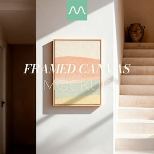 May include: A rectangular framed canvas featuring abstract horizontal bands of soft peach, muted sage green, and pale yellow colors. The artwork is displayed in a light wood frame and is centered on a white wall with visible sunlight shadows.