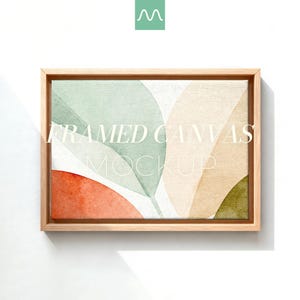 May include: A rectangular framed canvas featuring an abstract watercolor print with overlapping leaf-like shapes in muted sage green, soft beige, terracotta orange, and olive green. The text FRAMED CANVAS MOCKUP is centered on the artwork.