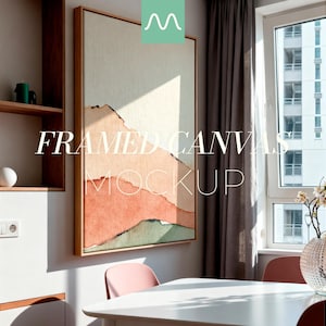 May include: Framed canvas mockup with an abstract landscape design in beige, orange, and green. The artwork is displayed in a room setting with a white table and pink chairs. The text "FRAMED CANVAS MOCKUP" is visible.