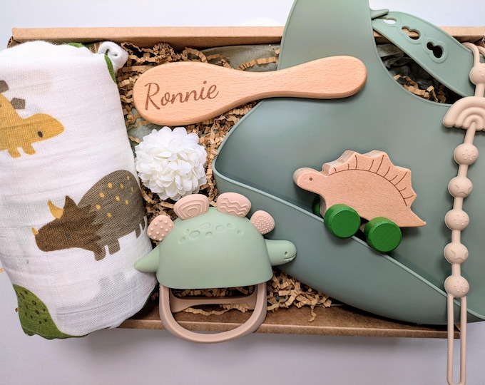New mum, baby shower, green dinosaur gift box; swaddle blanket, bib, personalised hair brush, teether, pacifier holder