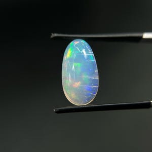 Natural Ethiopian White Opal 6 Carat AAA Oval Gemstone - Multi Fire Opal loose cabochon