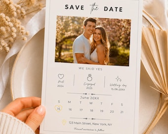 May include: A rectangular Save the Date card featuring a photograph of a couple, the text We Said Yes, and icons for Met 2024, Engaged 2025, and Wedding day 15-06-20XX. It includes a June 20XX calendar with the 15th circled and the address 123 Main Street, New York, NY.