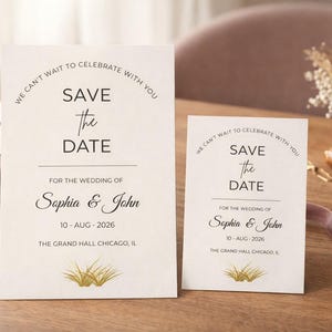 May include: Two white Save the Date cards with black text reading We Can't Wait To Celebrate With You, Save the Date, For the Wedding of Sophia & John, 10-Aug-2026, and The Grand Hall Chicago, IL, featuring a gold grass illustration at the bottom.