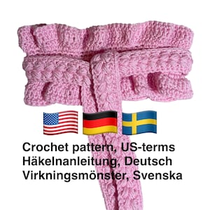 May include: A light pink crocheted scarf with a textured design. The scarf has a ruffled edge and a braided center. The image includes the text "Crochet pattern, US-terms".