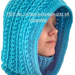 May include: A turquoise crochet hood with a textured pattern and a drawstring closure. The hood is worn by a person. Text on the hood reads "PDF file, crochet pattern in Swedish."