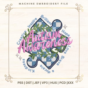 Op de afbeelding: Een borduurbestand met een puzzelstukontwerp met de woorden "Autisme Bewustzijn" in roze script. Het puzzelstuk heeft een blauw-wit geblokt patroon, met woorden als "Inspireren" en "Hoop" eromheen. Het ontwerp is omlijst met een gouden rand.