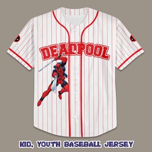 May include: White and red pinstripe baseball jersey featuring the word "DEADPOOL" in red block letters. A graphic of Deadpool in a dynamic pose with swords is on the front. The jersey has red trim and a Deadpool logo on the sleeve.