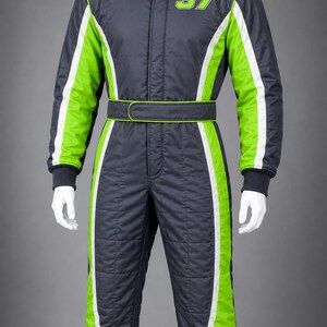 May include: A dark gray racing suit featuring bright lime green side panels with white piping accents. The suit includes a high collar with a hook-and-loop closure, a matching waist belt, and the number 37 printed in lime green on the chest.