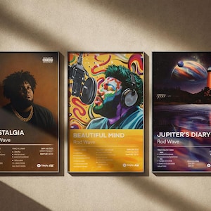 May include: Three framed posters featuring album art for Rod Wave. The posters display the album titles "Nostalgia", "Beautiful Mind", and "Jupiter's Diary". Each poster has a unique design with vibrant colors and includes track listings and Spotify logos.