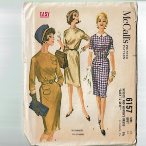 May include: A vintage sewing pattern for a dress, featuring three women wearing different styles of dresses. The pattern is labeled "McCall's Printed Pattern" and "6157". The text "Easy to Sew" is also included on the pattern.
