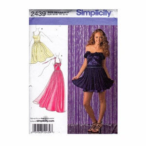 May include: Simplicity sewing pattern number 2439 for a dress. The pattern includes three different styles: a short yellow dress, a long pink dress, and a short purple dress. The pattern is for sizes 6-16, 30-38 EUR, and 32-40 FR.